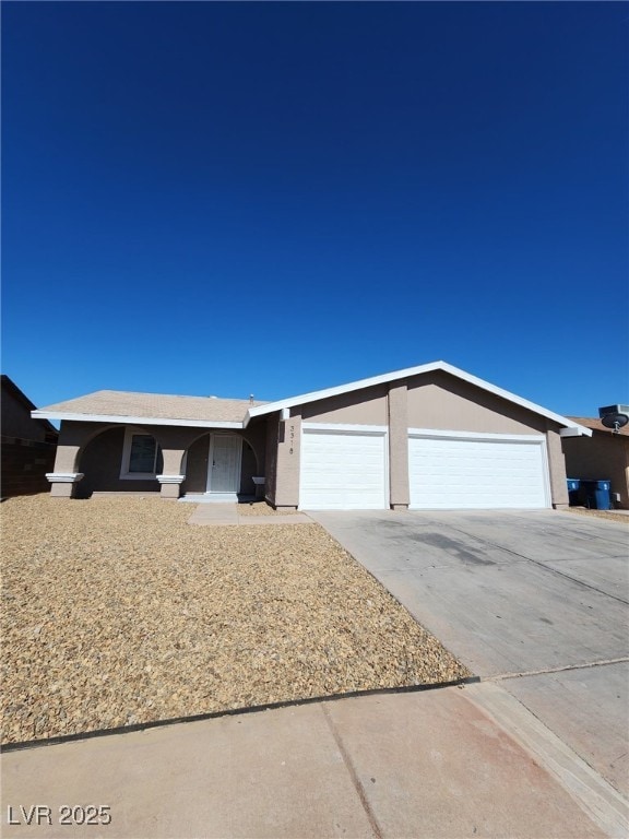 3318 Covey Ln, Las Vegas, NV 89115 - single story home with a garage, concrete driveway, and stucco siding