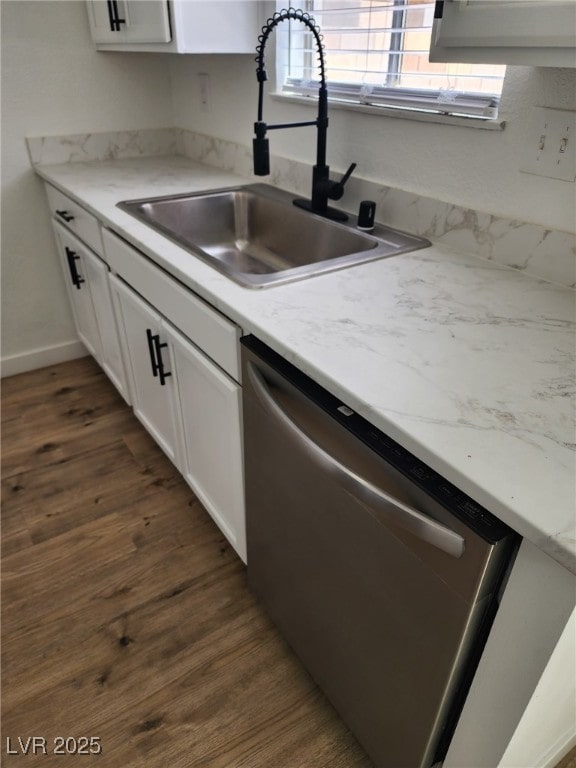 3318 Covey Ln, Las Vegas, NV 89115 - kitchen featuring stainless steel dishwasher, dark wood finished floors, and white cabinets