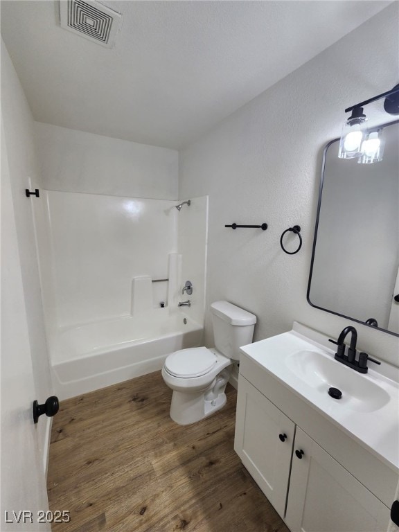 3318 Covey Ln, Las Vegas, NV 89115 - bathroom with wood finished floors, vanity, and tub / shower combination