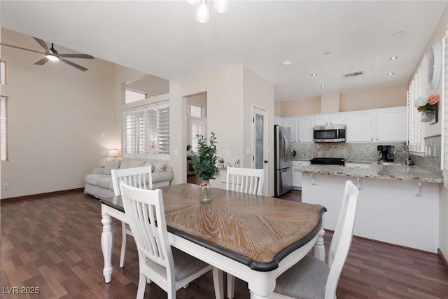 1839 Thunder Mountain Dr, Henderson, NV 89012 - dining space with ceiling fan, dark wood-type flooring, and recessed lighting