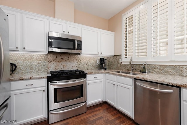 1839 Thunder Mountain Dr, Henderson, NV 89012 - kitchen featuring stainless steel appliances, white cabinetry, and tasteful backsplash