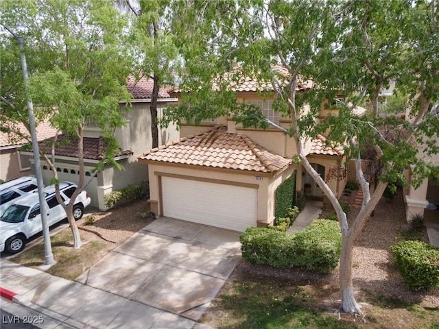 1839 Thunder Mountain Dr, Henderson, NV 89012 - view of front of house featuring stucco siding, concrete driveway, an attached garage, and a tile roof