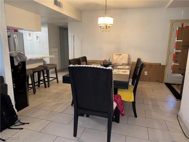 3447 One Nation Ave, Las Vegas, NV 89121 - dining space with a chandelier and light tile patterned floors