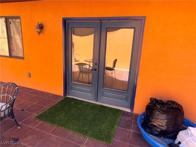 3447 One Nation Ave, Las Vegas, NV 89121 - doorway to property with french doors, stucco siding, and a patio area