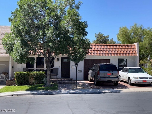 3447 One Nation Ave, Las Vegas, NV 89121 - view of front of house featuring stucco siding and a tiled roof