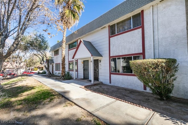 225 Pecos Way, Las Vegas, NV 89121 - townhome / multi-family property with roof with shingles and mansard roof