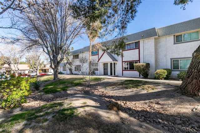 225 Pecos Way, Las Vegas, NV 89121 - rear view of property with mansard roof, a residential view, stucco siding, and a shingled roof