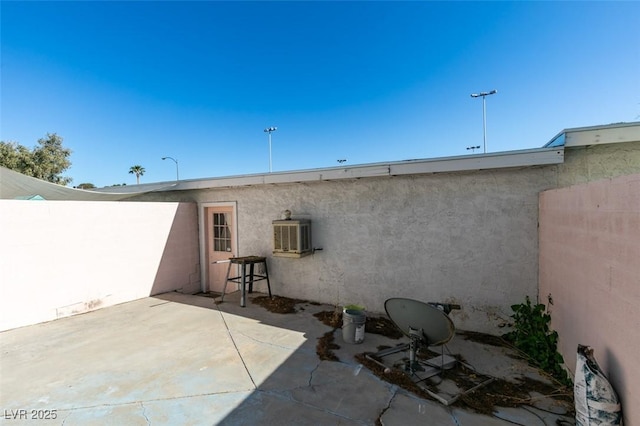225 Pecos Way, Las Vegas, NV 89121 - back of house featuring stucco siding and a patio area