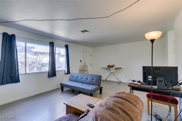 225 Pecos Way, Las Vegas, NV 89121 - living area with wood finished floors and a desk