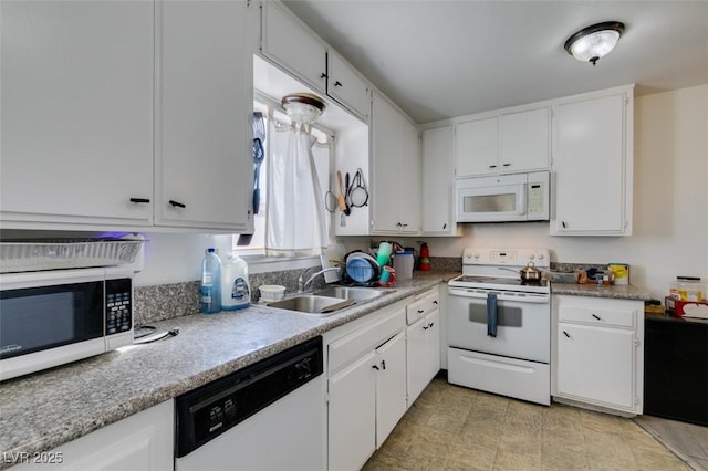 225 Pecos Way, Las Vegas, NV 89121 - kitchen with white appliances, white cabinets, and light countertops