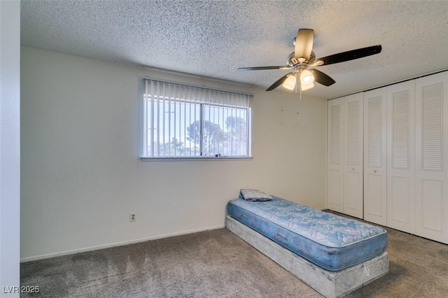 225 Pecos Way, Las Vegas, NV 89121 - bedroom with carpet, a textured ceiling, a closet, and a ceiling fan