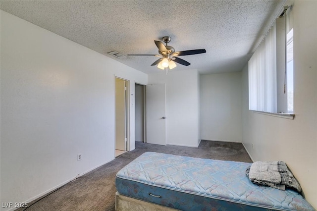 225 Pecos Way, Las Vegas, NV 89121 - carpeted bedroom featuring a textured ceiling and ceiling fan