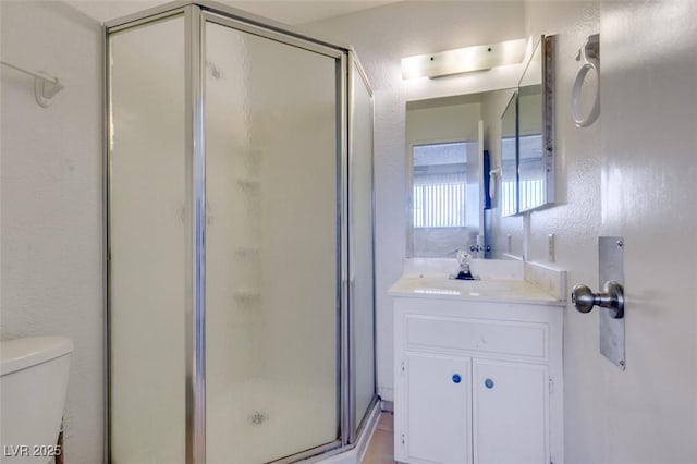 225 Pecos Way, Las Vegas, NV 89121 - bathroom with a stall shower, vanity, and a textured wall
