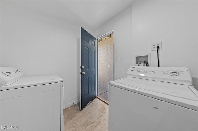 104 Stanford St, Las Vegas, NV 89107 - laundry room with washer and clothes dryer and light wood finished floors