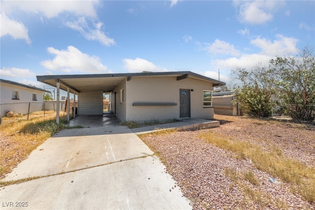 104 Stanford St, Las Vegas, NV 89107 - view of front of house with concrete driveway and a carport