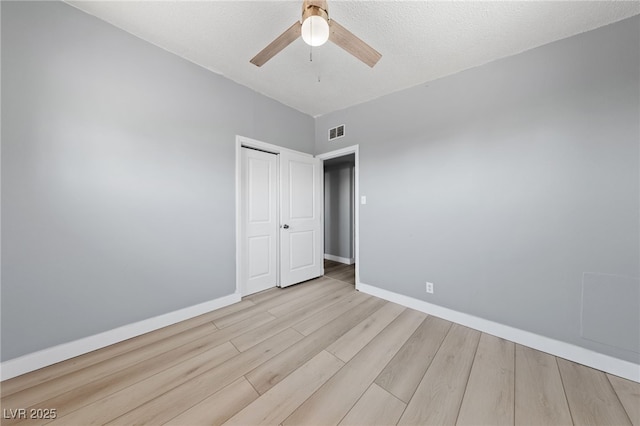 104 Stanford St, Las Vegas, NV 89107 - unfurnished bedroom featuring wood finished floors, a closet, and a ceiling fan