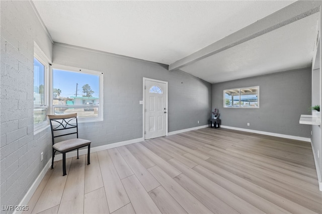 104 Stanford St, Las Vegas, NV 89107 - unfurnished room featuring light wood-style floors and brick wall