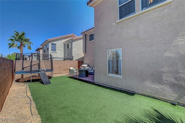 554 Haunts Walk Ave, Las Vegas, NV 89178 - fenced backyard featuring a trampoline and an outdoor hangout area