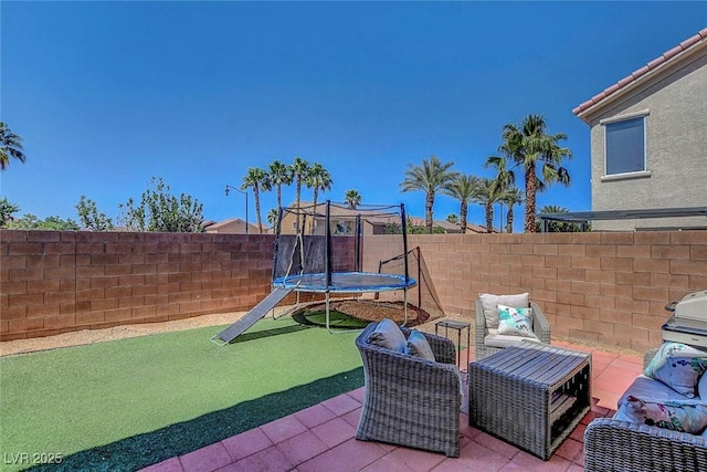 554 Haunts Walk Ave, Las Vegas, NV 89178 - fenced backyard featuring a trampoline and a patio