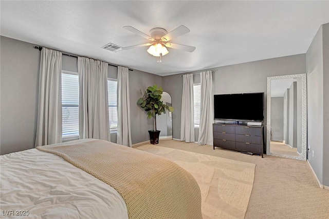 554 Haunts Walk Ave, Las Vegas, NV 89178 - bedroom featuring multiple windows, light colored carpet, and a ceiling fan