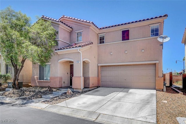 554 Haunts Walk Ave, Las Vegas, NV 89178 - mediterranean / spanish-style home with a tile roof, a garage, stucco siding, and concrete driveway