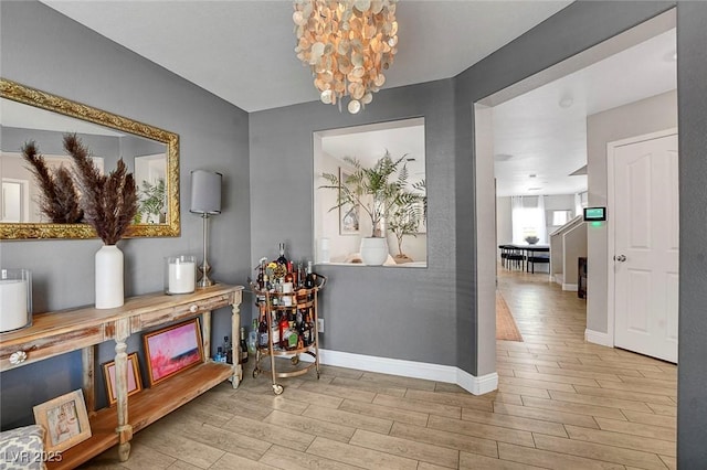 554 Haunts Walk Ave, Las Vegas, NV 89178 - hallway with wood finished floors and a chandelier