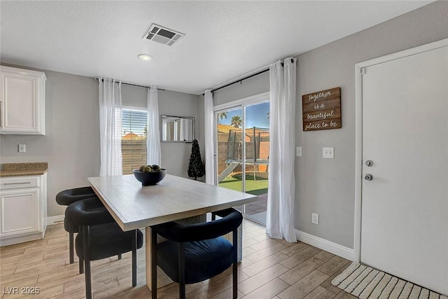 554 Haunts Walk Ave, Las Vegas, NV 89178 - dining area featuring light wood-style floors and baseboards