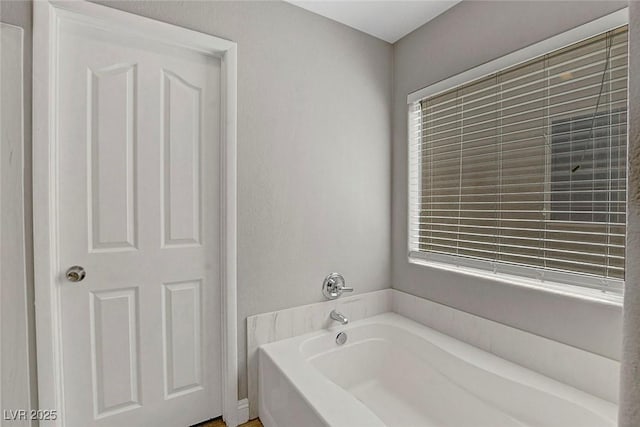 554 Haunts Walk Ave, Las Vegas, NV 89178 - bathroom featuring a bath and plenty of natural light