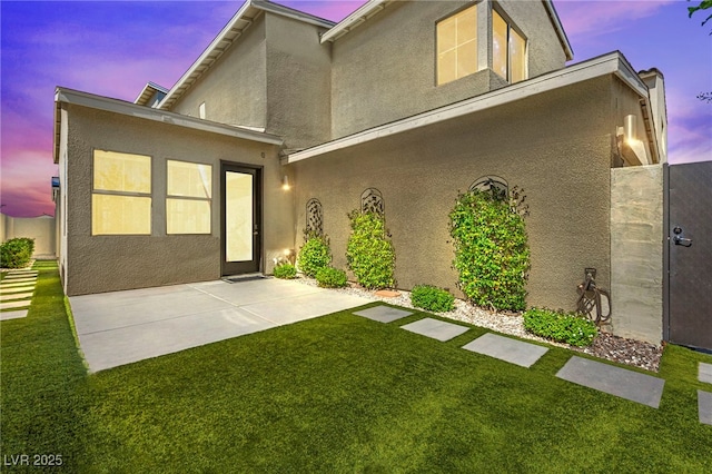 3058 Casarano Ct, Henderson, NV 89044 - back of house with stucco siding, a yard, and a patio area