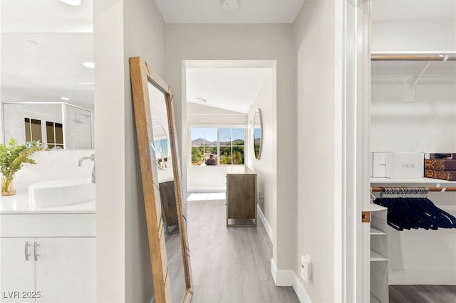 3058 Casarano Ct, Henderson, NV 89044 - corridor with a sink and wood finished floors