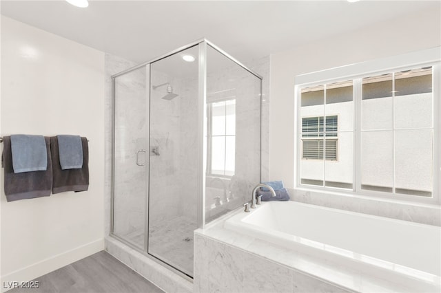 3058 Casarano Ct, Henderson, NV 89044 - full bathroom with a garden tub, a stall shower, recessed lighting, and wood finished floors