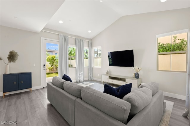 3058 Casarano Ct, Henderson, NV 89044 - living area featuring vaulted ceiling, light wood-style flooring, and recessed lighting