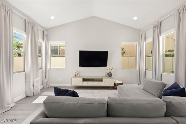 3058 Casarano Ct, Henderson, NV 89044 - living room featuring lofted ceiling, light wood-style flooring, and recessed lighting
