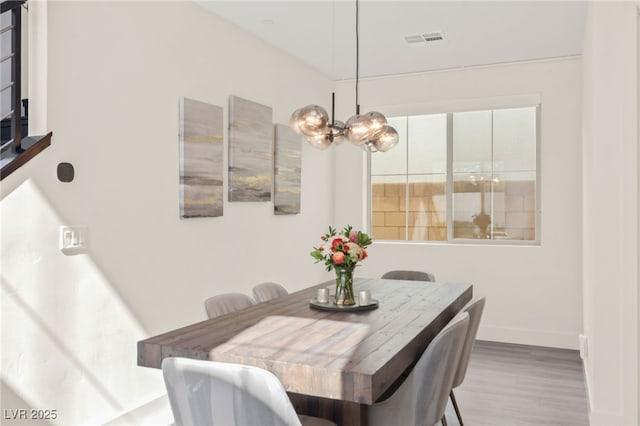 3058 Casarano Ct, Henderson, NV 89044 - dining space with wood finished floors and a chandelier
