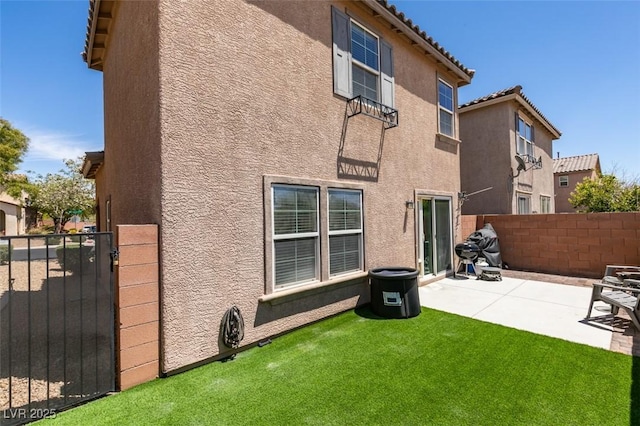 8733 Autumn Teal Ave, Las Vegas, NV 89178 - rear view of property featuring stucco siding, a patio area, and a gate