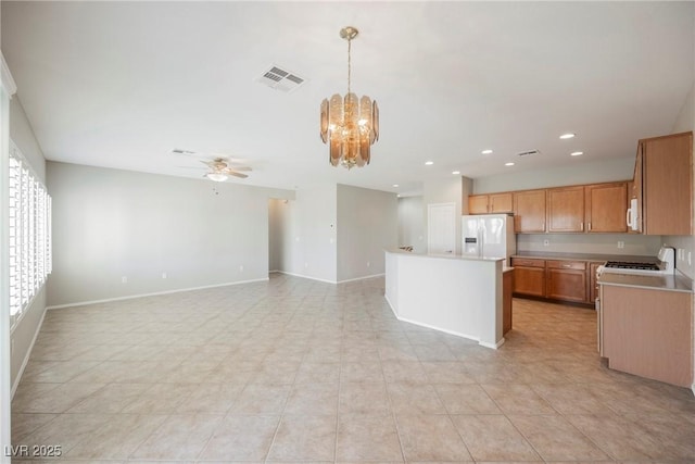 3405 Kingbird Dr, North Las Vegas, NV 89084 - kitchen featuring white fridge with ice dispenser, a chandelier, a ceiling fan, recessed lighting, and light countertops