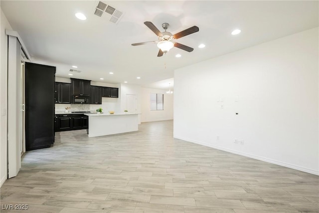 12426 Mosticone Way, Las Vegas, NV 89141 - unfurnished living room featuring ceiling fan, recessed lighting, and light wood-type flooring