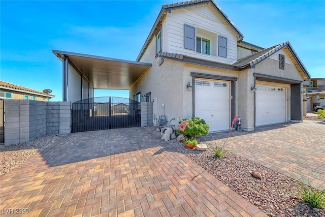 1523 Great Sands St, Boulder City, NV 89005 - view of front of home featuring a gate, decorative driveway, and stucco siding