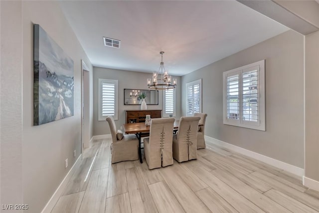 1523 Great Sands St, Boulder City, NV 89005 - dining area featuring a chandelier and light wood-style floors