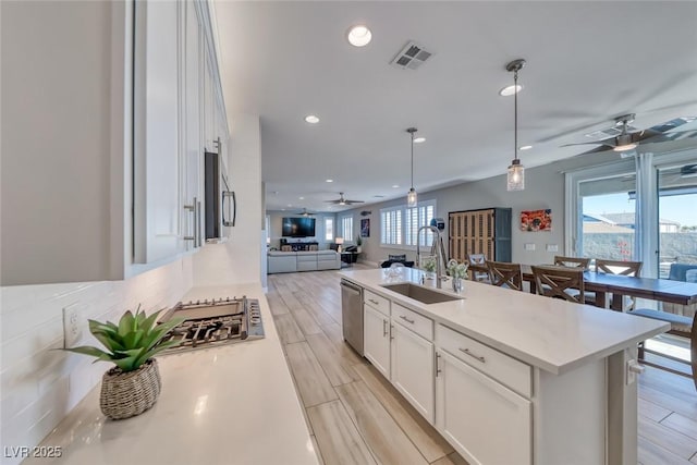 1523 Great Sands St, Boulder City, NV 89005 - kitchen with a ceiling fan, open floor plan, appliances with stainless steel finishes, white cabinets, and recessed lighting