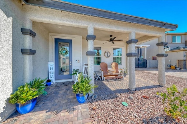 1523 Great Sands St, Boulder City, NV 89005 - doorway to property featuring a ceiling fan, stucco siding, and covered porch