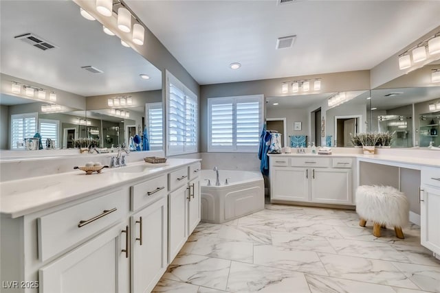 1523 Great Sands St, Boulder City, NV 89005 - bathroom featuring two vanities, a bath, marble look tile flooring, and recessed lighting