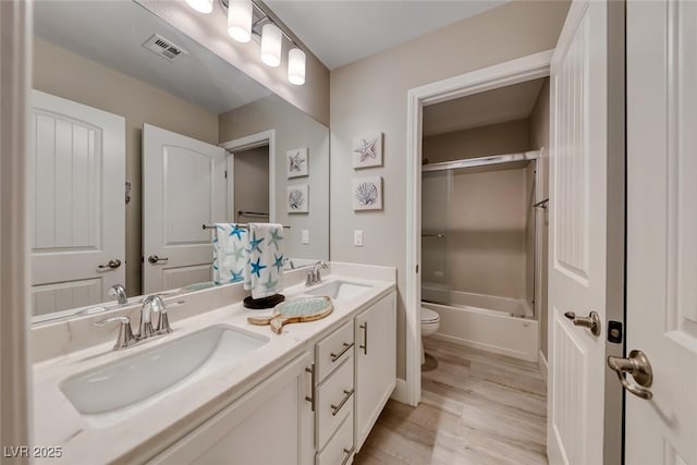 1523 Great Sands St, Boulder City, NV 89005 - full bath with double vanity, wood finished floors, and shower / bathtub combination