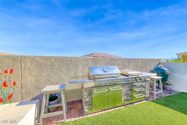 1523 Great Sands St, Boulder City, NV 89005 - fenced backyard with an outdoor kitchen