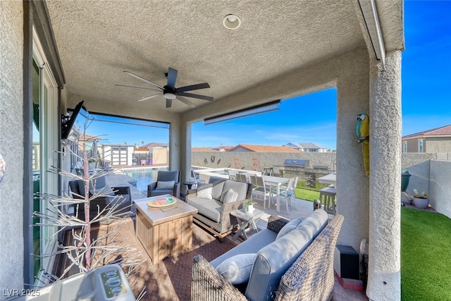 1523 Great Sands St, Boulder City, NV 89005 - fenced backyard with a ceiling fan and an outdoor living space