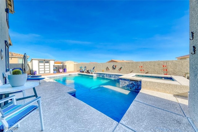 1523 Great Sands St, Boulder City, NV 89005 - view of swimming pool featuring a fenced backyard, a patio, a pool with connected hot tub, and an outdoor structure