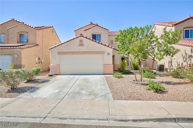700 Red Bark Ln, Henderson, NV 89011 - mediterranean / spanish home featuring an attached garage, stucco siding, a tile roof, and driveway