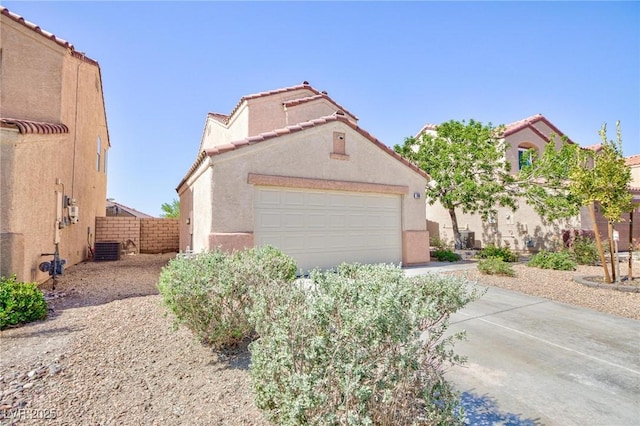 700 Red Bark Ln, Henderson, NV 89011 - view of front of home featuring an attached garage, stucco siding, driveway, and a tile roof