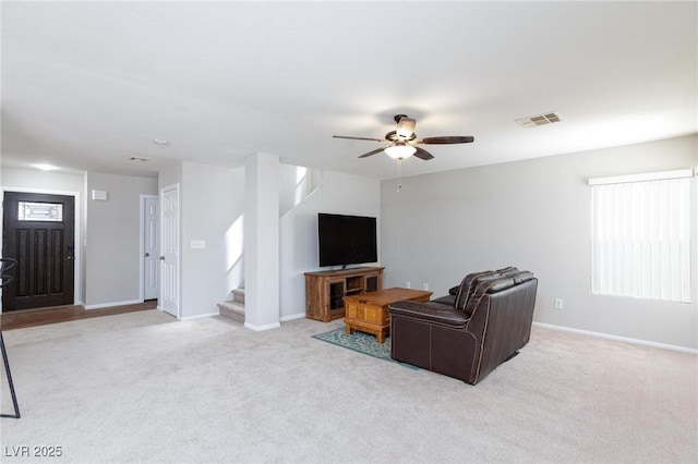 700 Red Bark Ln, Henderson, NV 89011 - carpeted living area with stairway and ceiling fan