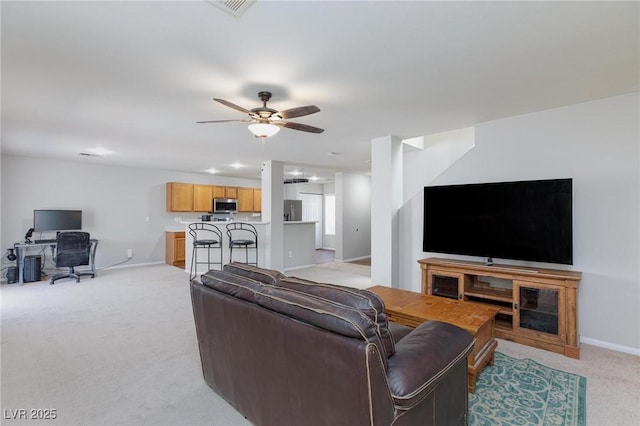 700 Red Bark Ln, Henderson, NV 89011 - living room featuring light carpet, a desk, and a ceiling fan